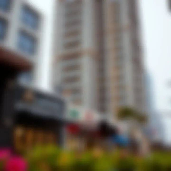 Community dynamics surrounding Al Manzil Tower with local shops and parks