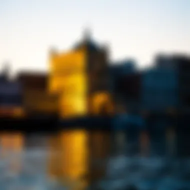 Historical architecture along Dubai Creek illuminated by the golden light of the setting sun