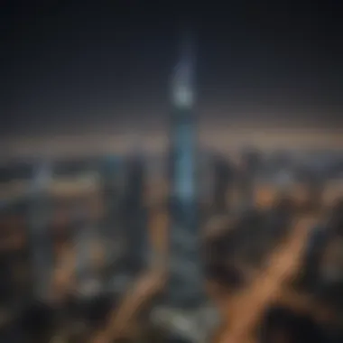 Night view of Safeer Tower illuminated against the Dubai skyline